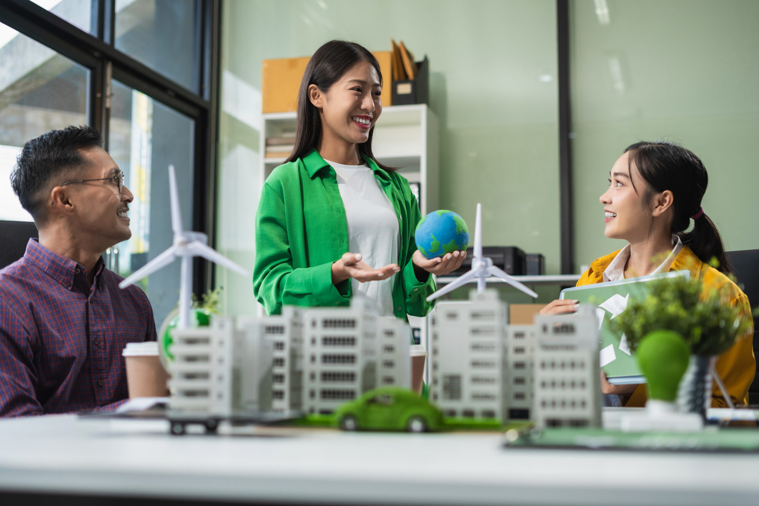 Businessman team brainstorming using tablet, laptop computer for working technology and business,  Renewable energy-based green businesses and global warming. Reduce CO2 emission.