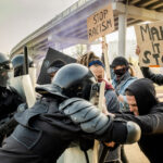 Fighting against protesting people at rally