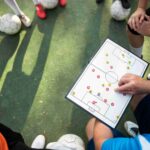 football-trainer-teaching-his-pupils_11zon