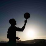 side-view-man-doing-tricks-with-ball_11zon