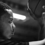 african-american-teenage-boy-concentrated-playing-basketball_11zon