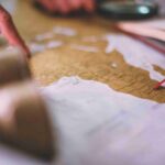 close-up-hands-reading-map_11zon