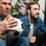 father-son-watching-game_11zon