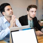 two-professionals-listening-business-conference-speaker_11zon